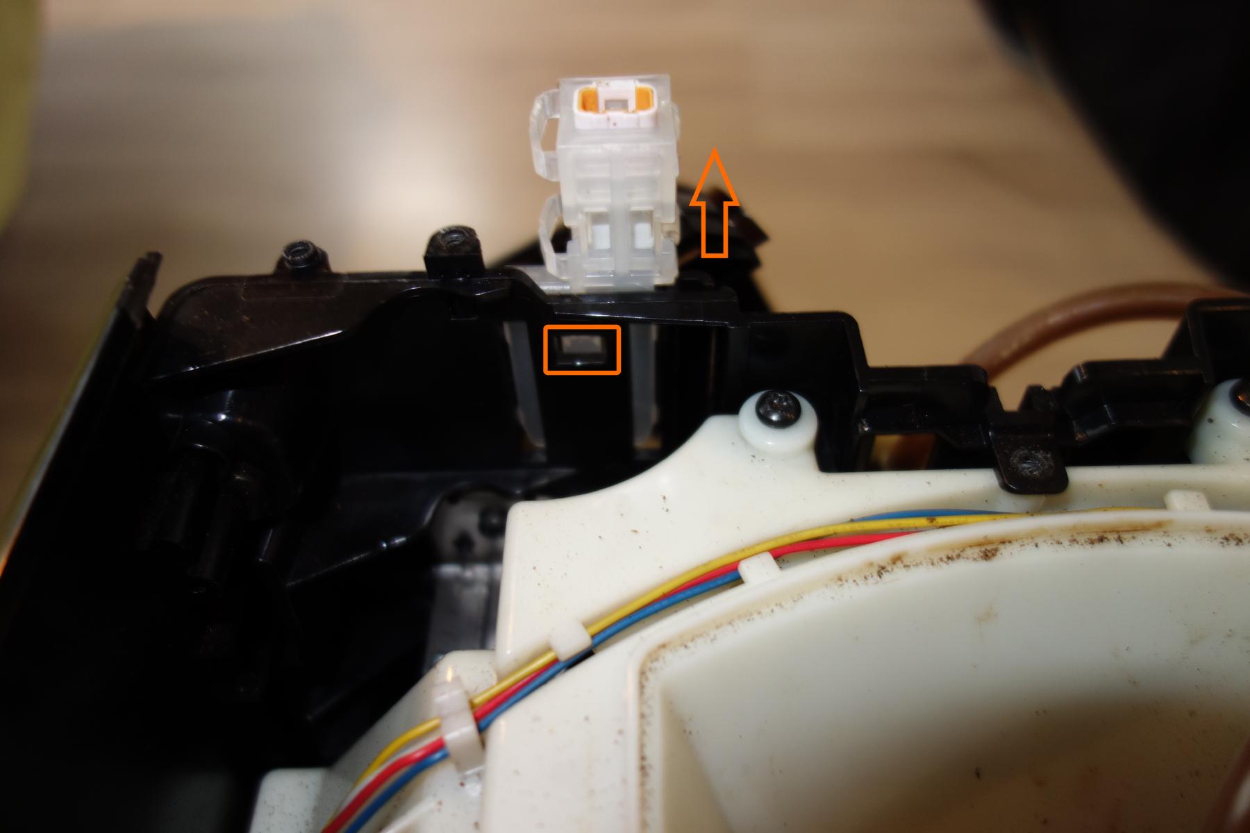 Step 2b : Push with a flat screwdriver on the orange rectangle location. Push the debug connector to the top.